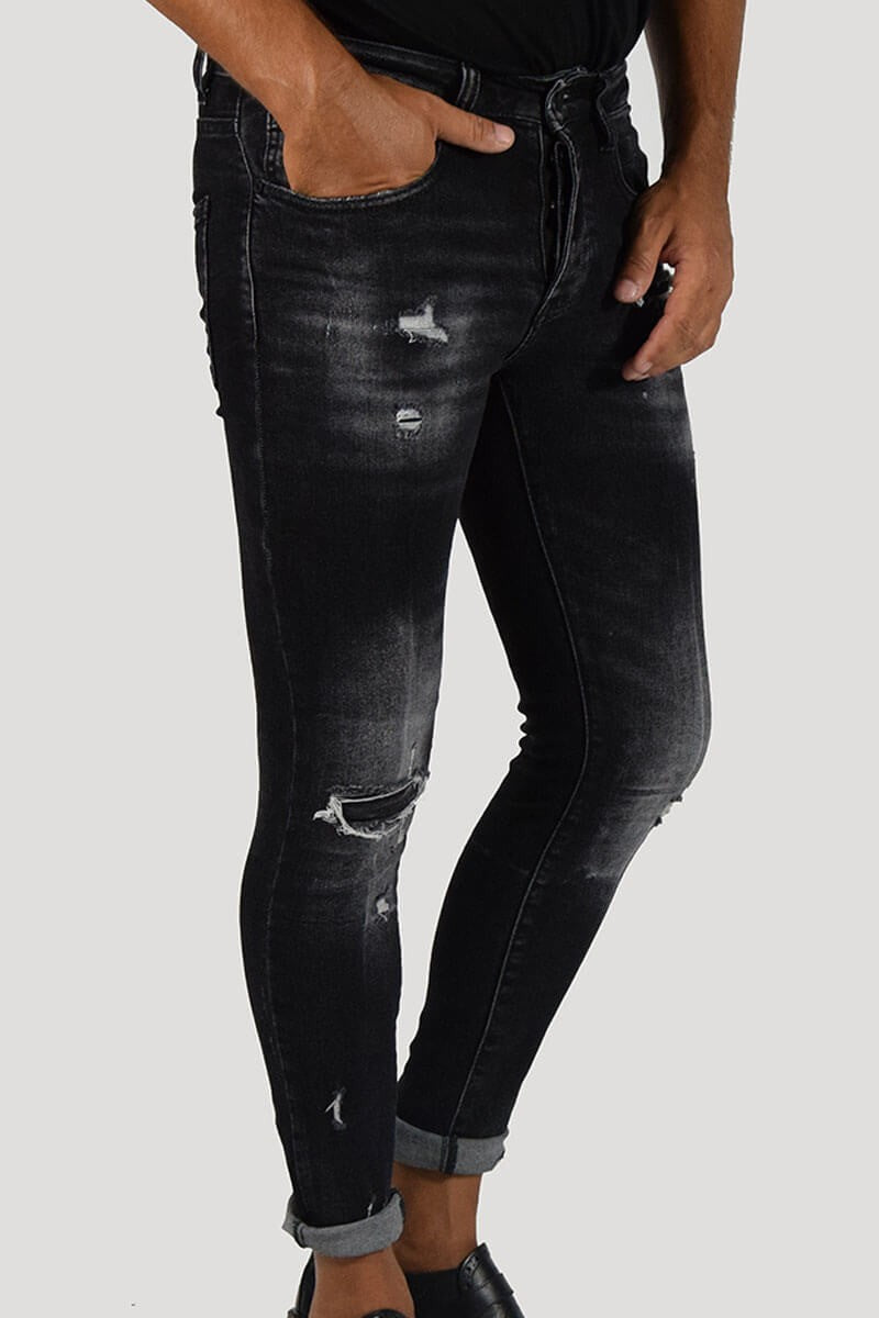 JEANS SKINNY CON STRAPPI