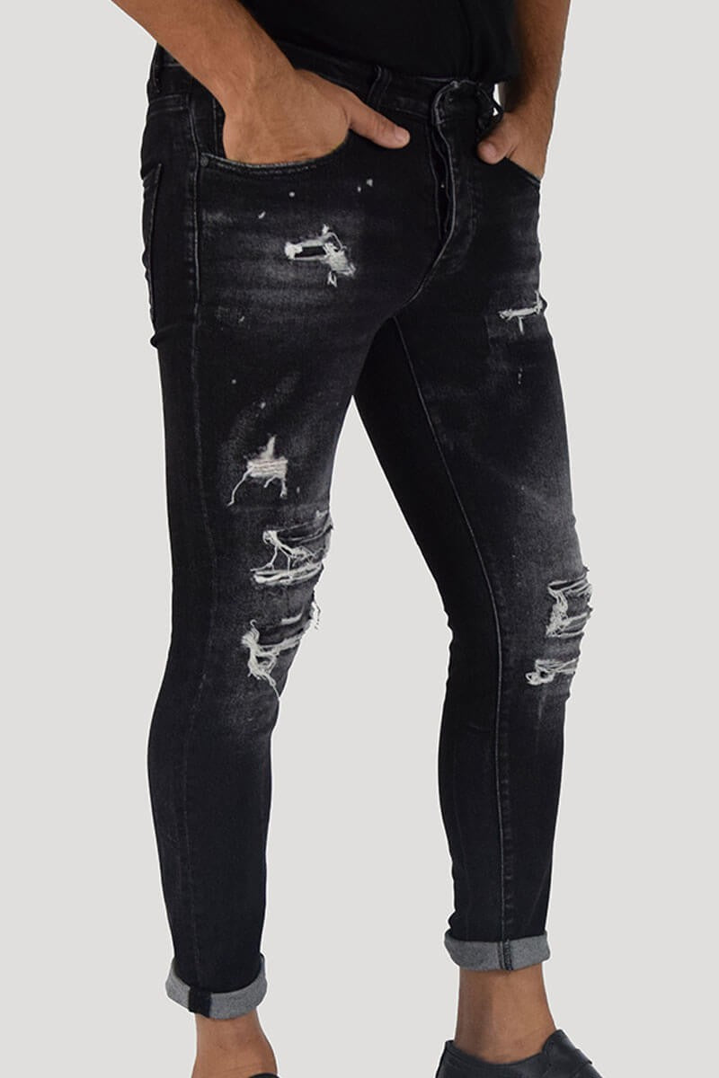 JEANS SKINNY CON STRAPPI E PITTURA
