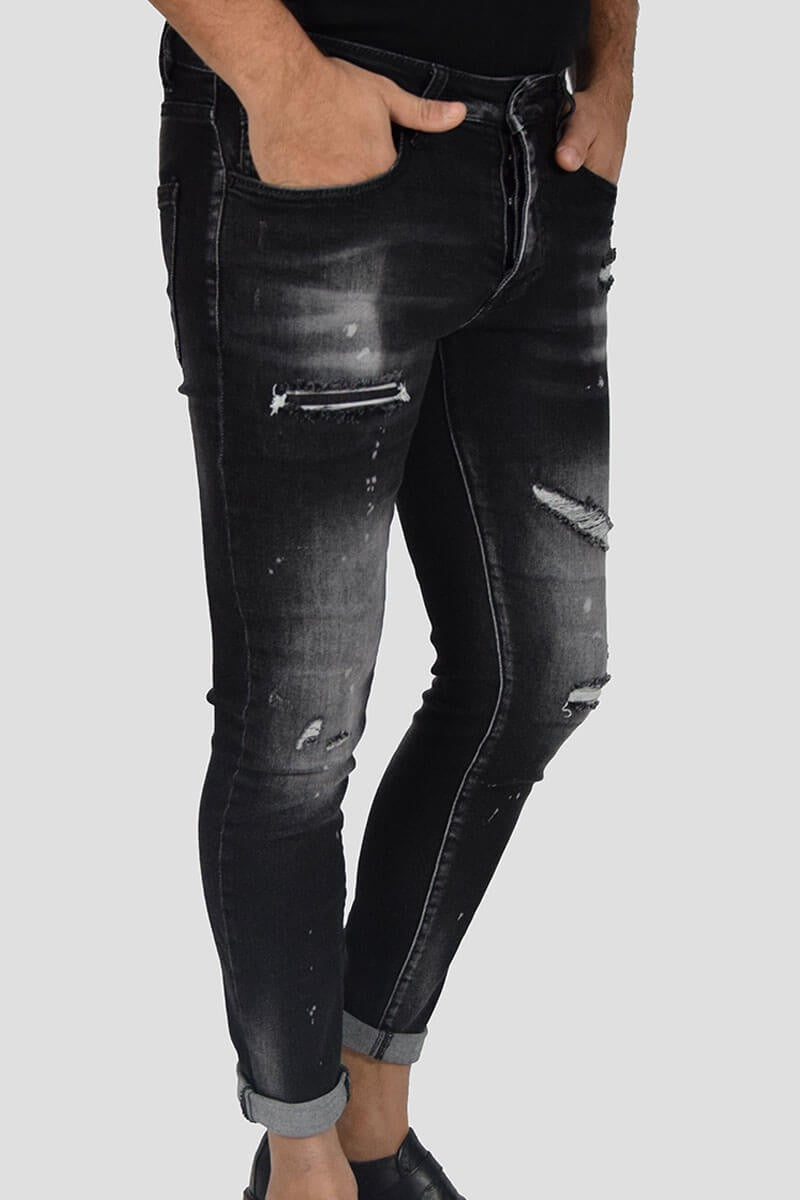 JEANS SKINNY CON STRAPPI E PITTURA