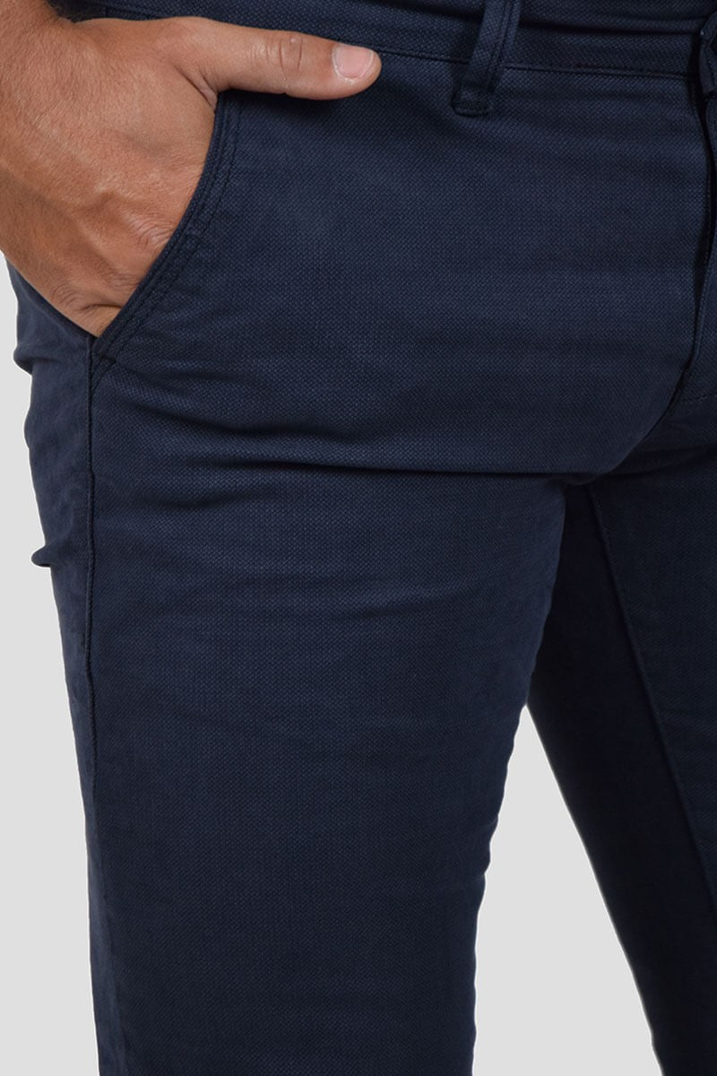 PANTALONI SKINNY CON MICROFANTASIA