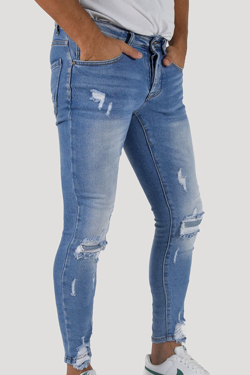 JEANS SKINNY CON STRAPPI