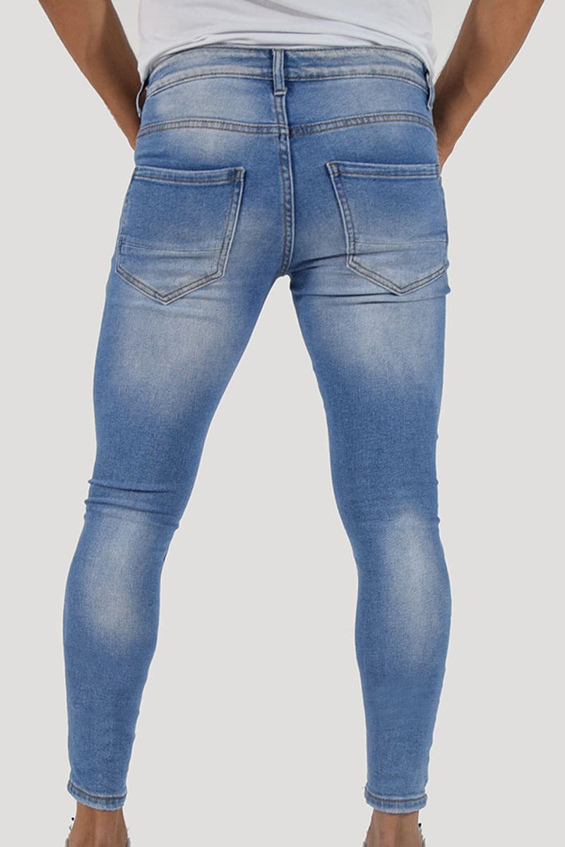 JEANS SKINNY CON STRAPPI