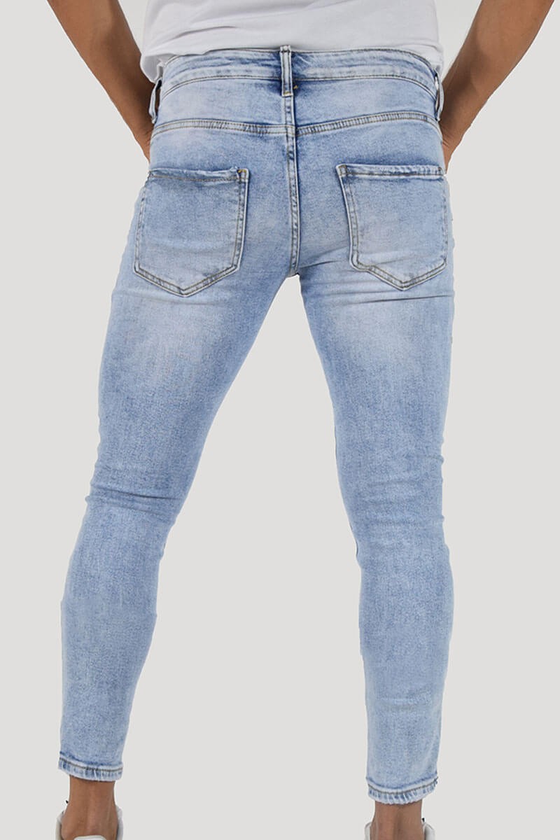 JEANS SKINNY CON STRAPPI
