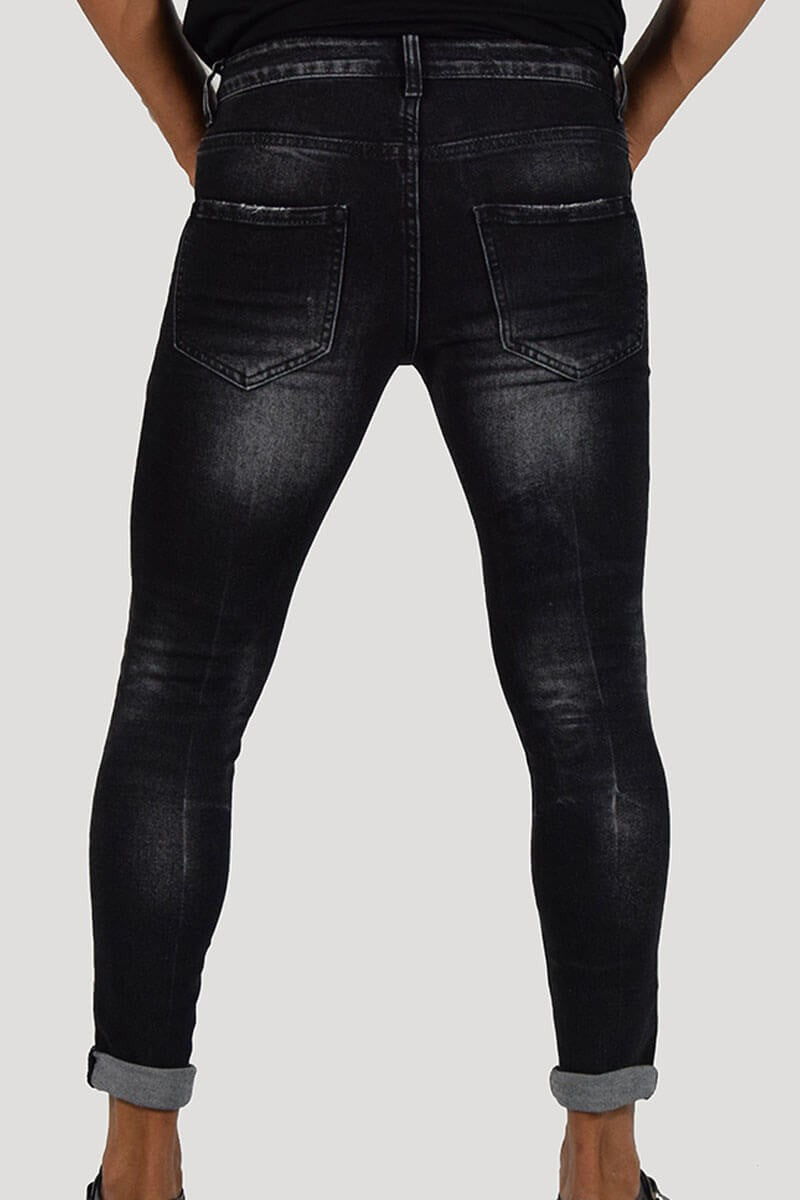 JEANS SKINNY CON STRAPPI