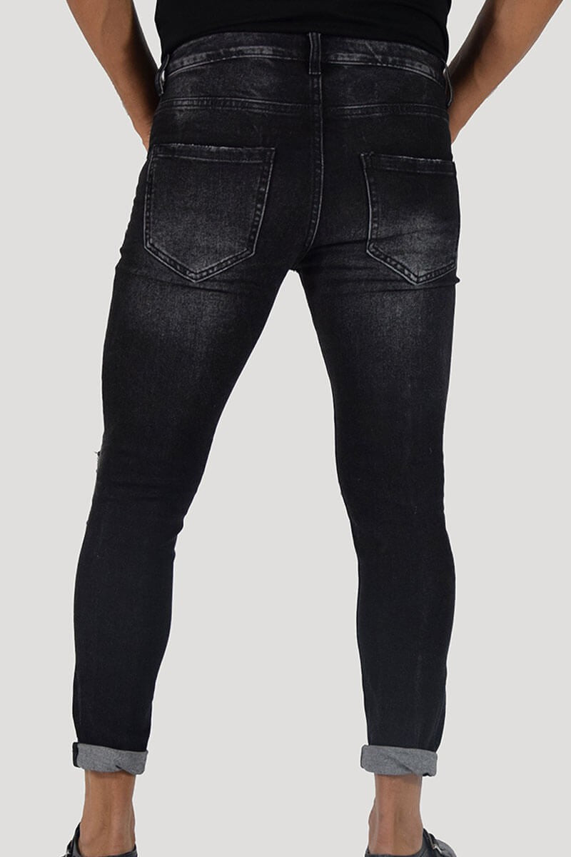 JEANS SKINNY CON STRAPPI E PITTURA