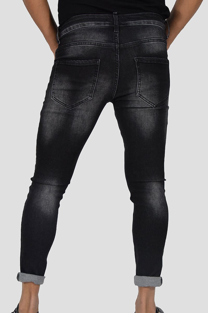 JEANS SKINNY CON STRAPPI E PITTURA