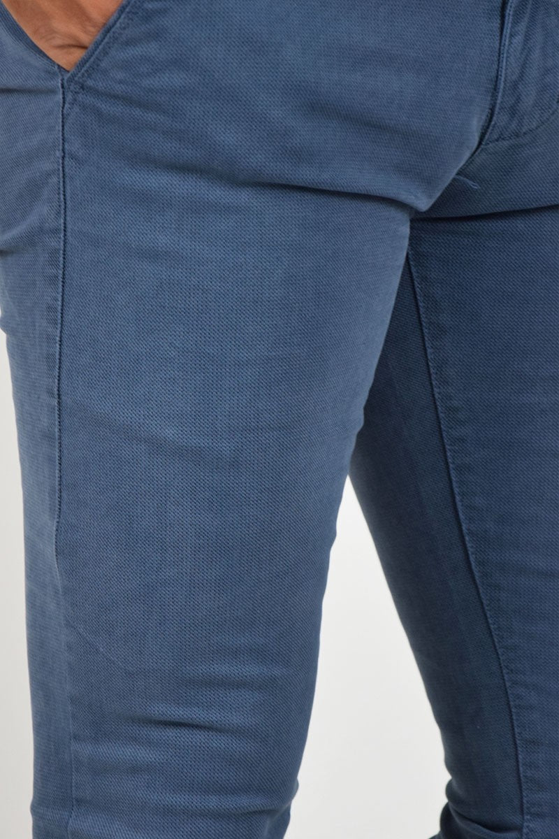 PANTALONI SKINNY CON MICROFANTASIA