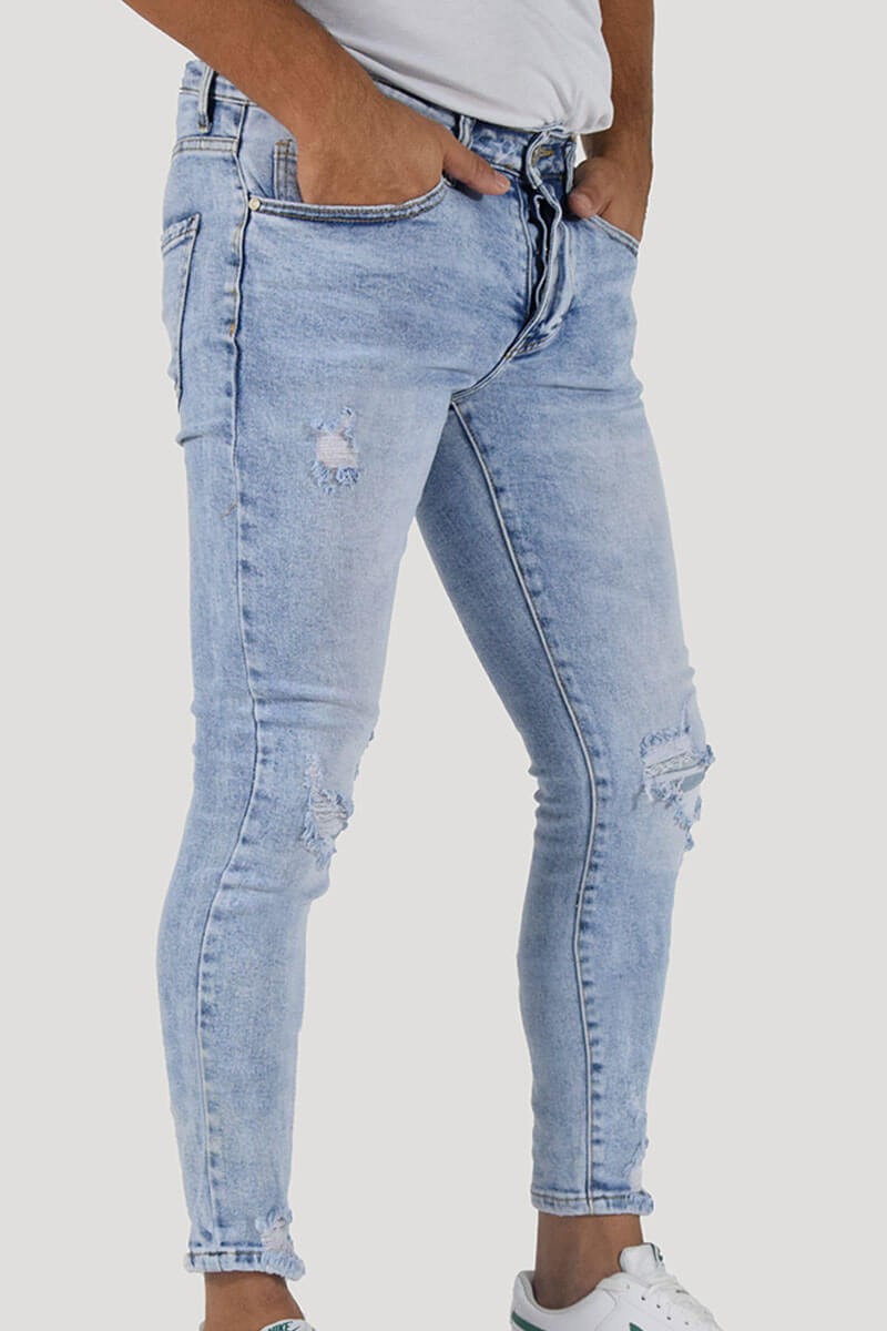 JEANS SKINNY CON STRAPPI